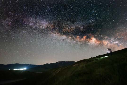 The space of the universe. Beautiful panoramic view of the the lake and mountain with Milky Way galaxy. 