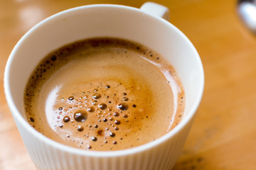 A cup of satisfying morning coffee on the breakfast table