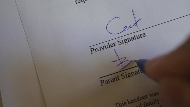 The Man Signs The Document With His Signature. Slider Shot. Fake signature. Fake Document.