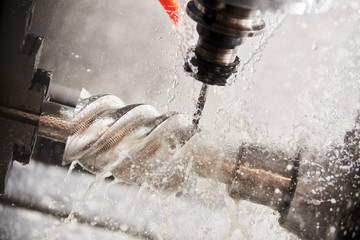 CNC milling machine work. Coolant and lubrication in metalwork industry © Kadmy