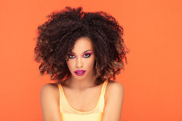 Beauty portrait of afro girl in glamour makeup.