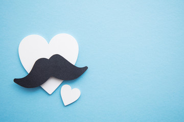 Black mustache with love hearts. Father's day or mens health concept
