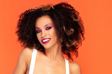 Happy afro girl in glamour makeup.