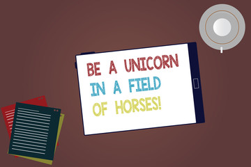 Word writing text Be A Unicorn In A Field Of Horses. Business concept for Make the difference being special Tablet Empty Screen Cup Saucer and Filler Sheets on Blank Color Background