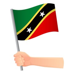 Saint Kitts and Nevis flag in hand