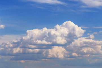 Blue sky with white cumulus fluffy clouds background texture