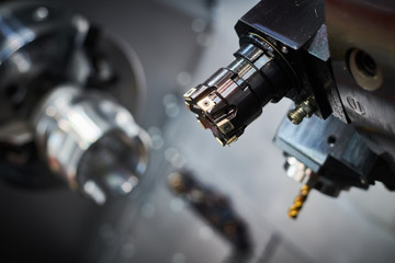 cnc machine at metalwork industry. milling multitool precision manufacturing and metal machining