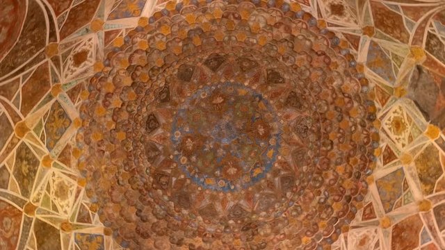 Amazing, beautiful architectural details and patterns on the walls and ceiling inside the ancient Indian temple in one of the buildings in complex Taj Mahal, Agra, India. Shot in motion