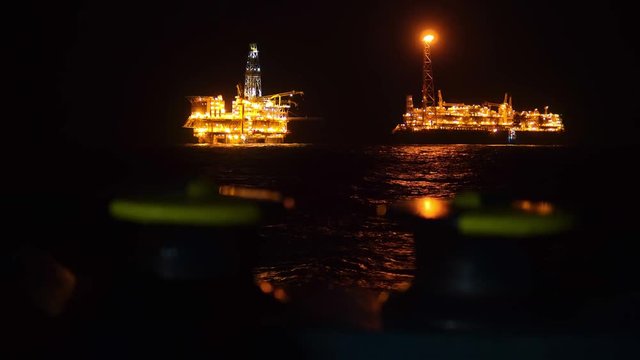 FPSO tanker vessel near Oil platform Rig. Offshore oil and gas industry, sea oil production and storage.