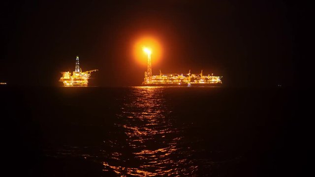 FPSO tanker vessel near Oil platform Rig. Offshore oil and gas industry, sea oil production and storage.