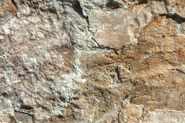 Structure of surface of the stone, used as background. Stone texture. Natural rocks