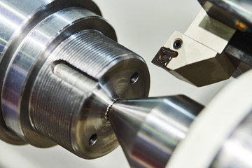 turning cnc machine at metal work industry. Precision manufacturing and machining