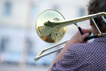 male musician plays the trombone. music and creativity. jazz and Blues.