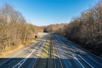 Bend in the road on an empty highway, with no cars or motorists in sight