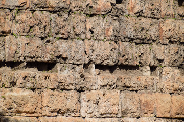 The wall near the gate of Hadrian, the texture of the stone walls of ancient stone blocks.