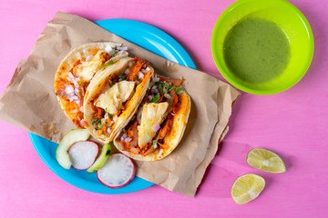 Mexican food: Authentic tacos al pastor with lime and pineapple