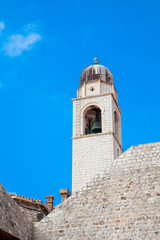 Fototapeta na wymiar Clock tower of Dubrovnik old town seen from the city old port