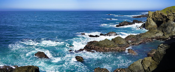 Panoramic view of coastline scenery of blue sky with rocks and sea on Pacific Coast, California