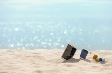 coffee paper cup with tablet put on the white sand beach - Summer relax  and marketing digital on line ,Holidays concept.