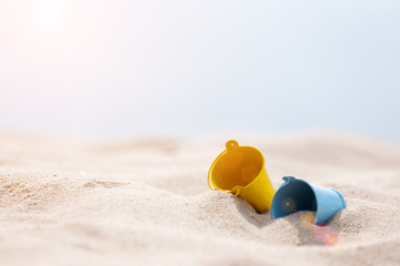 Fototapeta na wymiar toys put on the white sand beach