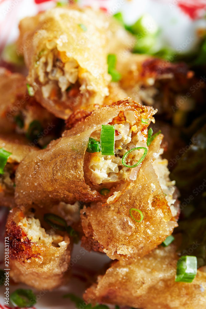 Wall mural deep fried spring rolls with spring onion