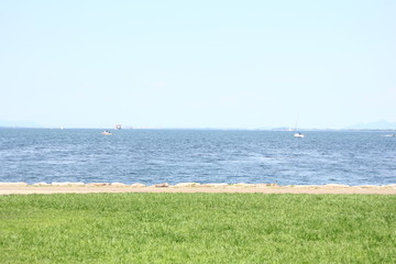 view of beach with blue sky and clouds