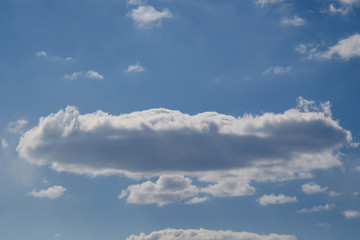 the extended cloud light from above and dark from below