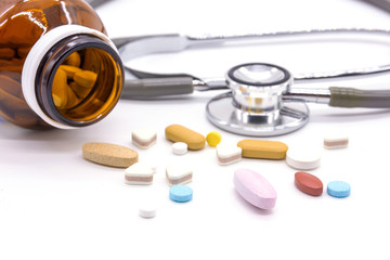 Difference tablets pills heap mix isolated on white background.
