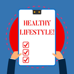 Handwriting text writing Healthy Lifestyle. Conceptual photo way of living that lowers the risk of being seriously ill White rectangle clipboard with blue frame has two holes holds by hands