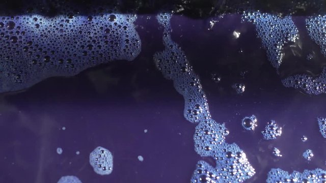 Closeup Of Denim Being Processed & Dyed In Manufacturing.