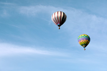 Multi colored hot air balloons on blue sky