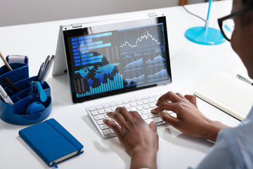 Businesswoman Analyzing Graph On Computer