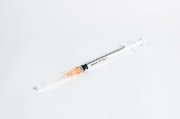 Close up new injection needle isolated on white background