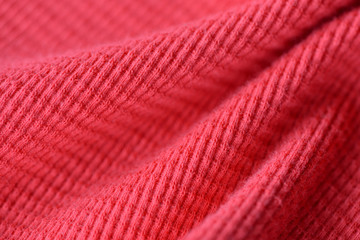 Textile texture coral color close up. Textile background