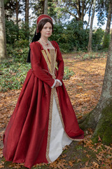 Dark-haired Tudor woman in red dress