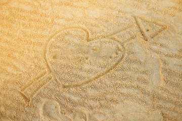 Fototapeta na wymiar Heart drawn in the sand.