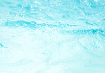 Fototapeta na wymiar Blurred water, glittering bokeh abstract; background nature