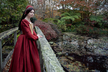 Obraz na płótnie Canvas Dark-haired Tudor woman in red dress