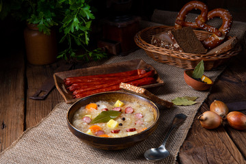 rustic sauerkraut soup with bacon and sausage