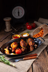 grilled chicken legs in barbecue marinade with sweet potatoes