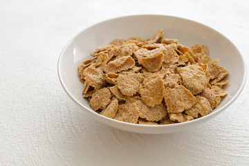Bowl of Toasted Oatmeal Flakes in White Background Tasty, Healthy Breakfast, Good Source of Fiber and Vitamins