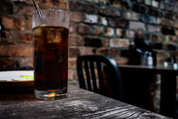 Glass of cola on a irish pub.
