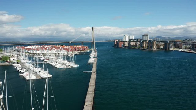Stavanger Sailing Boat Marina Cinematic Aerial With Typical Nordic Houses and Bybrua Bridge Over Bay in Oil Industry Capital Of Norway 4k