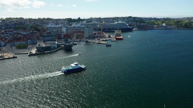 Cinematic Aerial of Bay With Boat in Sea And Cruise Ships in Harbour Port in Stavanger Oil Industry Capital of Norway 4k