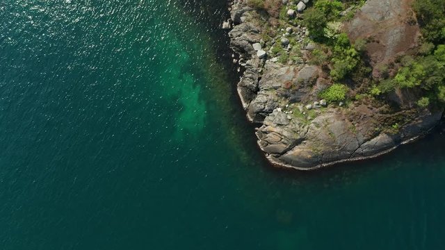 Cinematic Rotation Bird Eye Aerial of Rocky Sea Shore on Norway Nordic Coast in Stavanger 4k