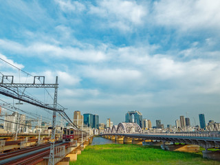 阪急新淀川橋梁と十三大橋 大阪キタの街並み