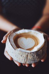 Close up coffee latte art in coconut.