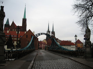 Beautiful view of the historic part of Wroclaw over the bridge and the paved road. Poland.