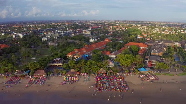  Aerial view of the beach with multicolored umbrellas and decks