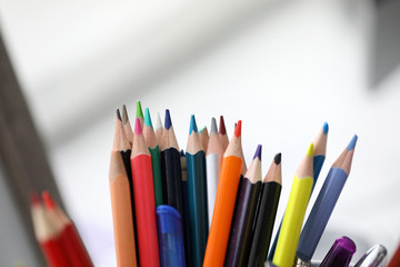 Bunch of various pencils stand in holder